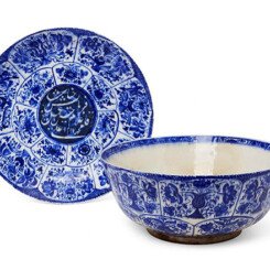 A blue-and-white inscribed pottery bowl and dish signed by Muhammed, Iran, both dated 1287AH/1870AD, 32cm. diam.; the bowl with inscription and date to interior within a shamsa, the exterior with lobed panels containing flowers, 30cm. diam. x 13cm. high A blue-and-white inscribed pottery bowl and dish