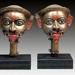 A PAIR OF BRASS HEADS, KARNATAKA, SOUTH INDIA