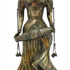 An Large Indian Silver standing figure of a musician playing Drums