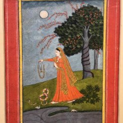 A Forlorn mistress casting off her jewellery as she stands near the banks of a stream by moonlight, she wears an orange sari with a gold Veil, flowering tree with a light blue sky in the background.
